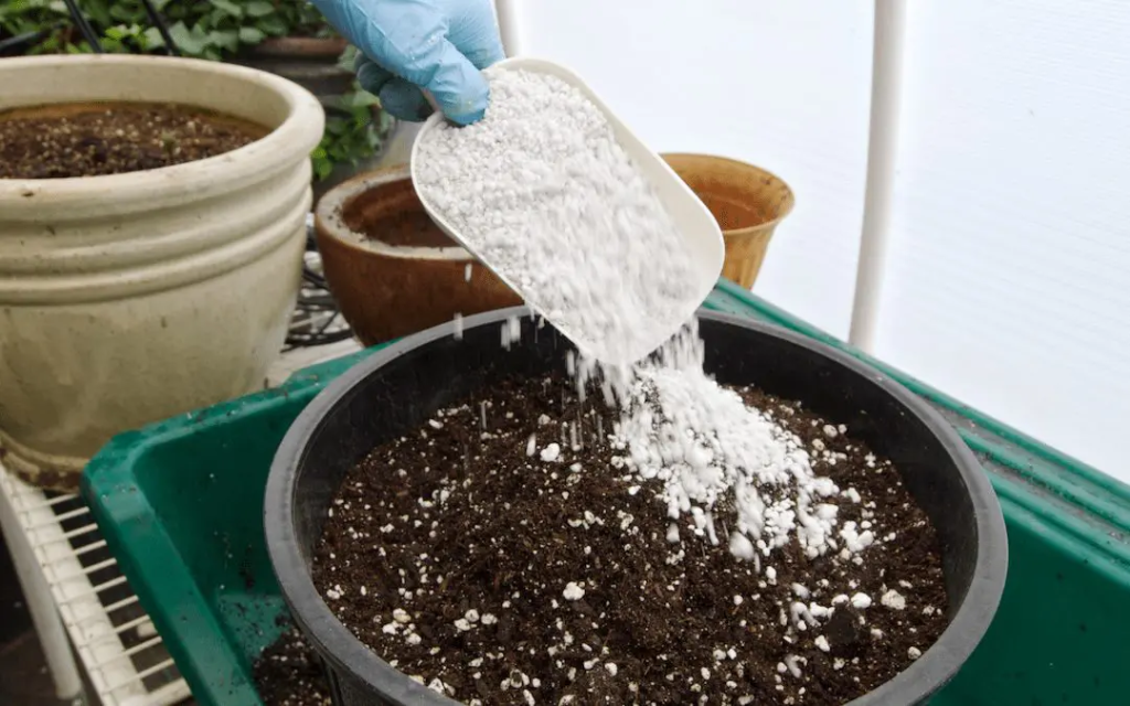 Adding perlite to potting soil.
