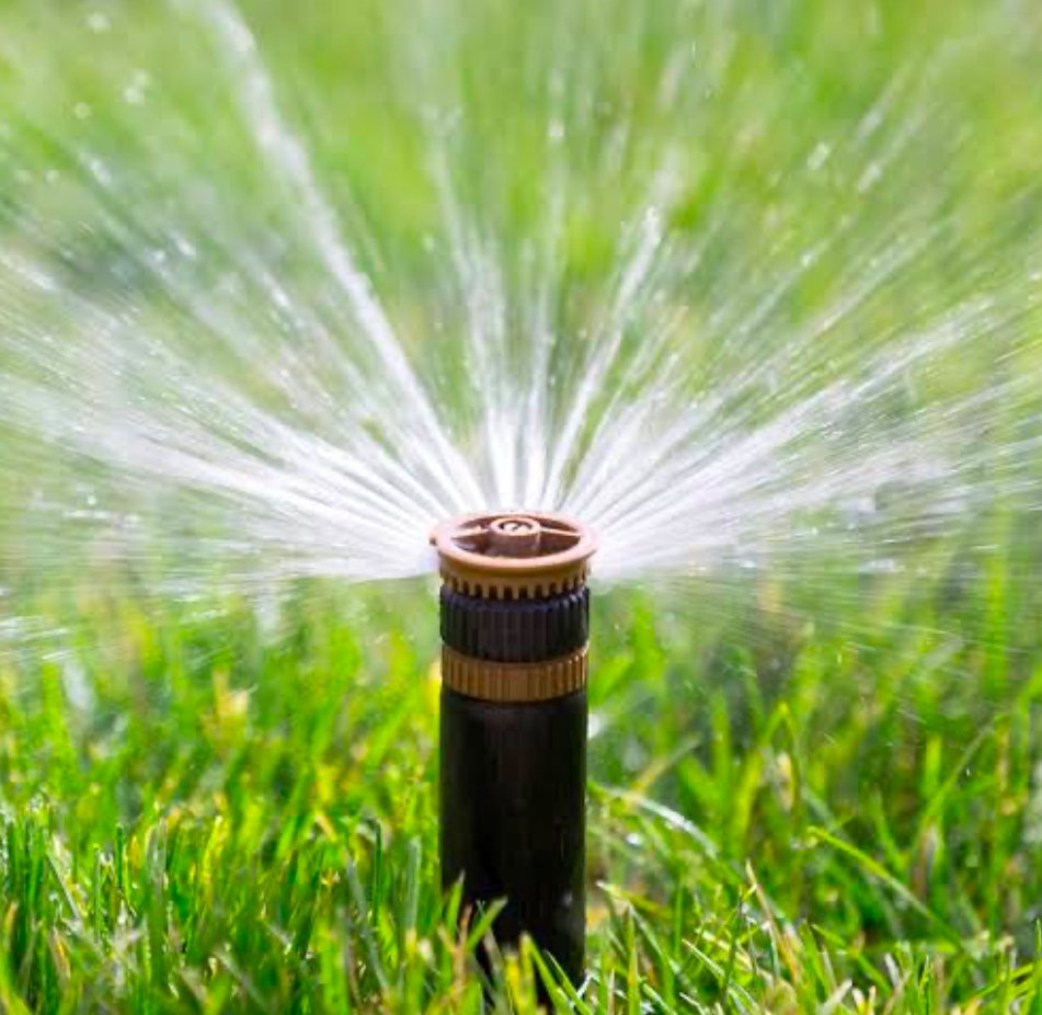 A sprinkler head spurting water.