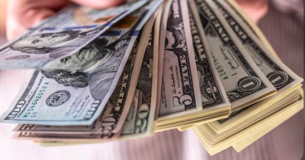A closeup of money in hands.