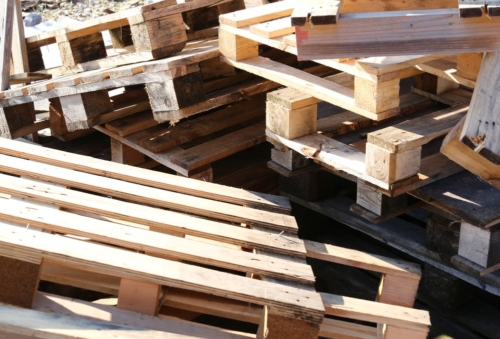 A pile of pallets stacked high.
