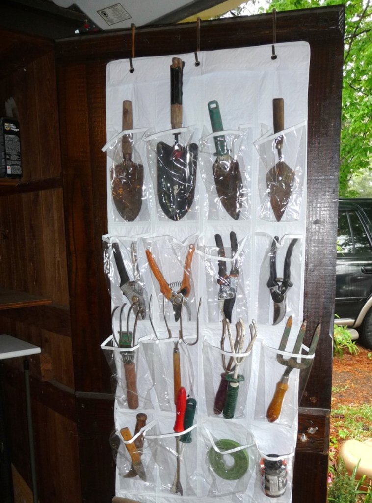 A over the door hanging shoe rack being used as a tool holder.