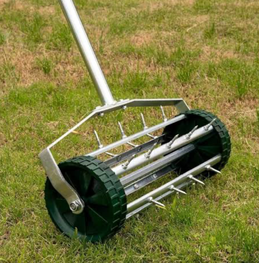 Rolling lawn aerator with metal spikes used for deep soil aeration