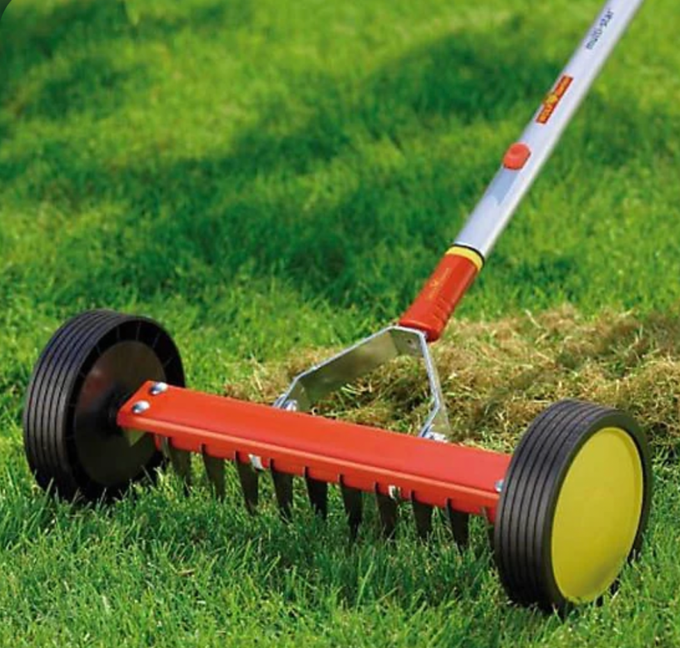 Push lawn dethatcher rake with wheels for easy thatch removal