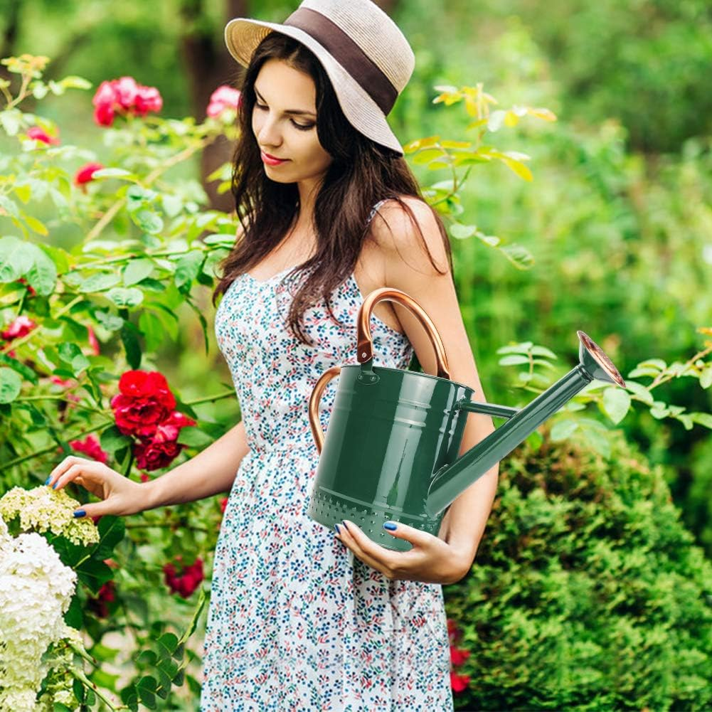1 Gallon Galvanized Steal Watering Can with Removable Spout being held by a woman in a polka dot dress in a garden.