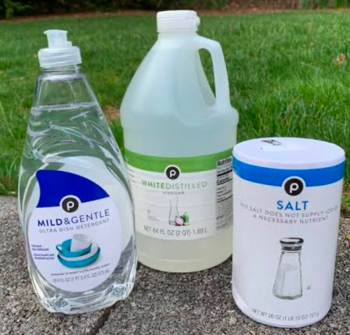 White vinegar, dish soap and table salt for a homemade weed killer recipe.