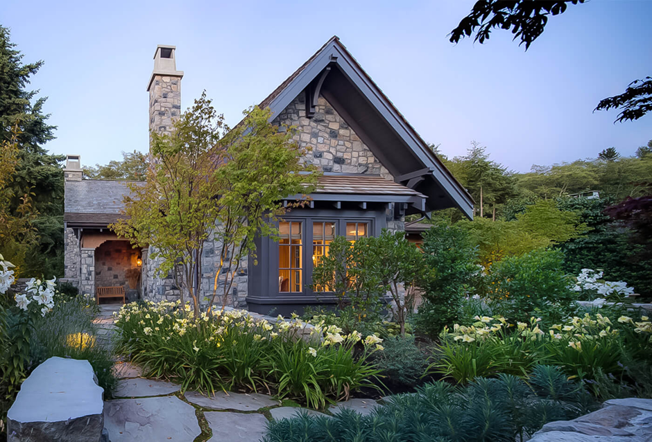 Stone cottage with lush cottage garden and flagstone path
